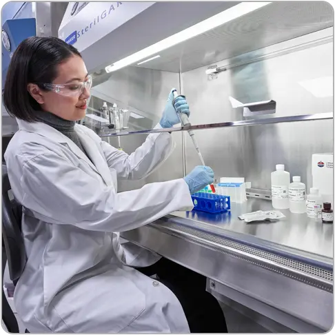 Scientist in lab testing samples - Standard BioTools Custom Reagents